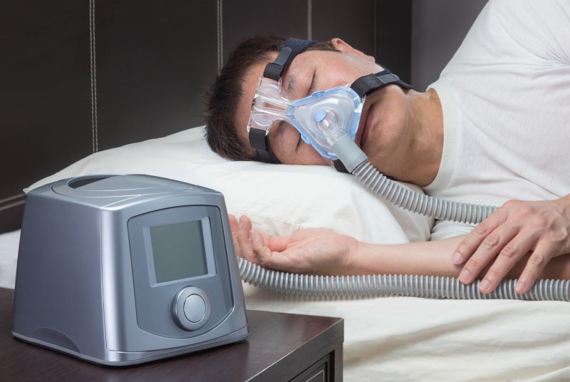 someone sleeping with a cpap machine